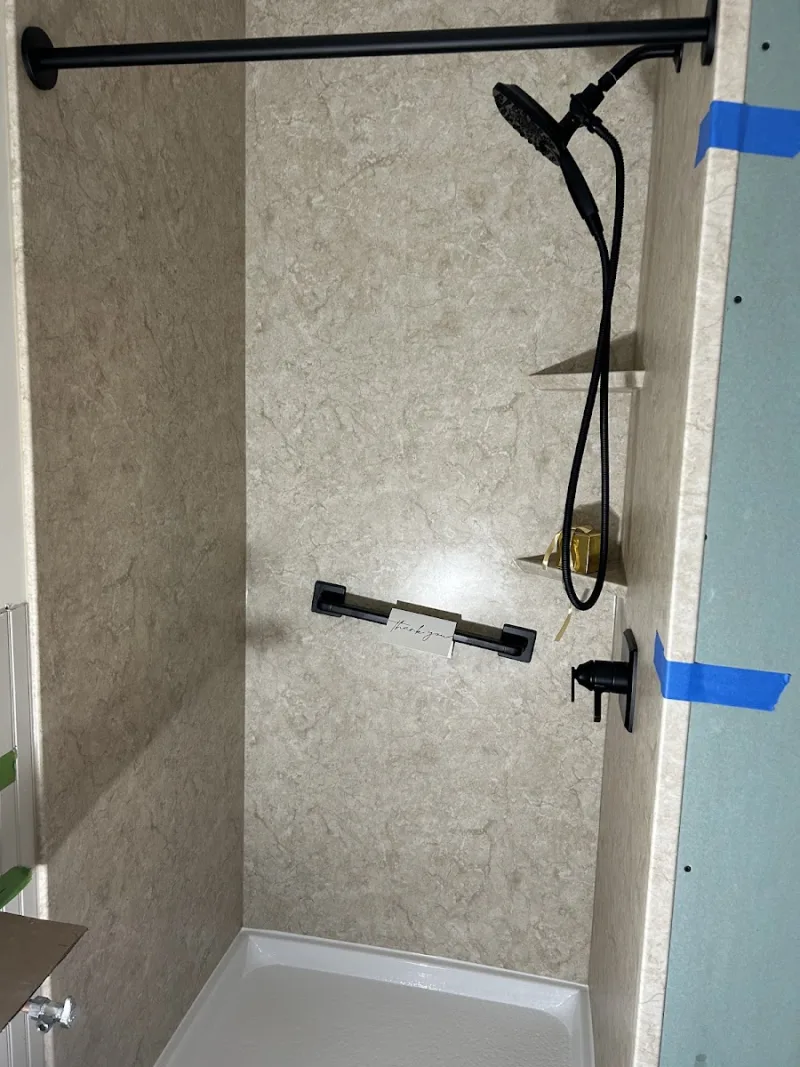 New stone-look walk-in shower installed by Yankee Home