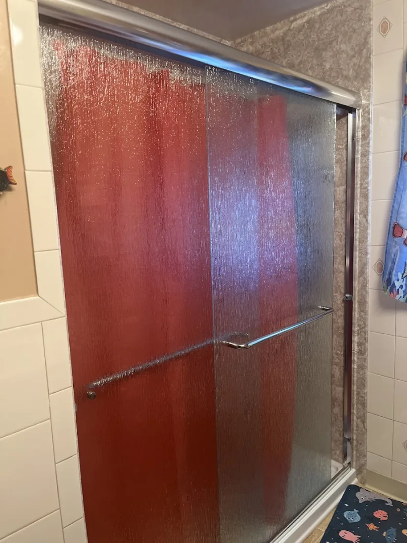 New shower with glass door installed by Yankee Home